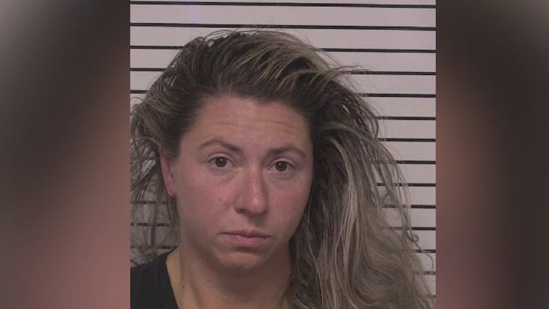 Officer Elizabeth Snowman was charged with accessing computers. She got a $5,000 bond and was...